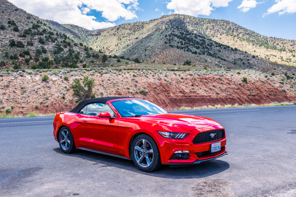 expensive red car on arizona road