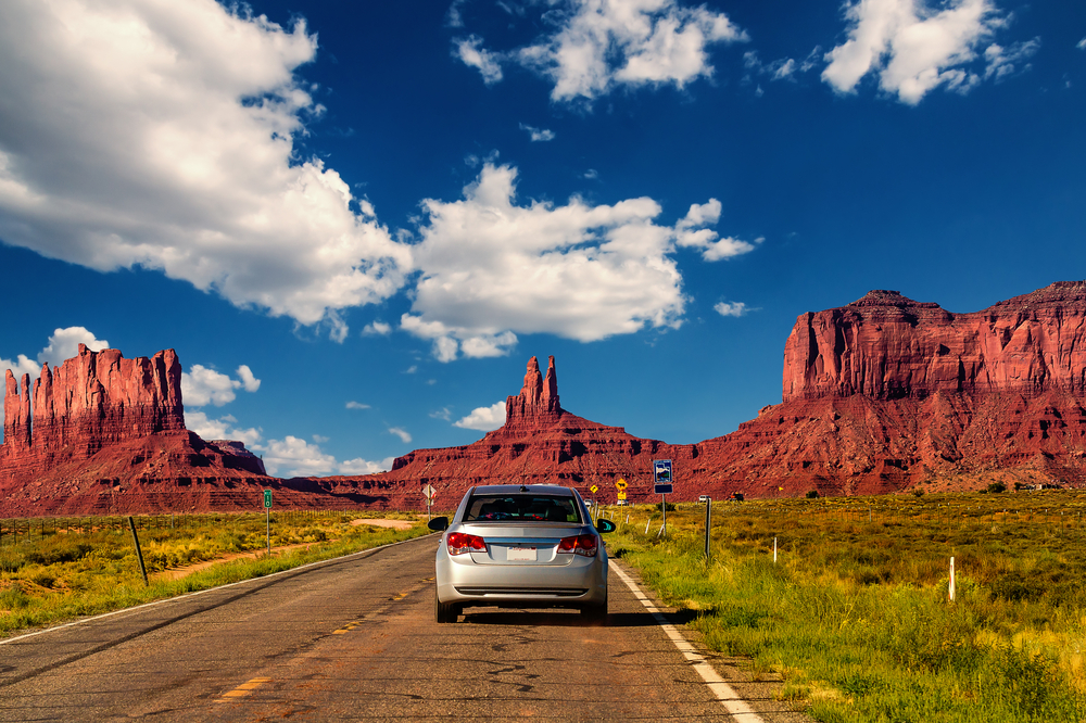 sedan driving down arizona highway