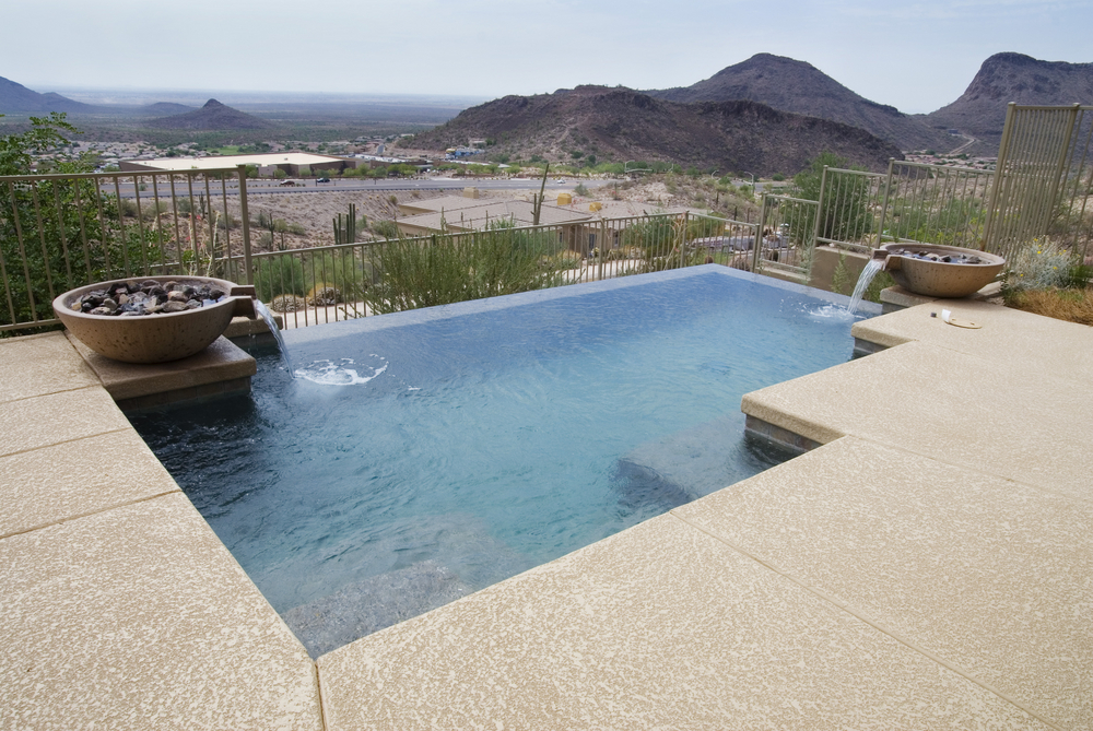 private swimming pool in backyard in desert city