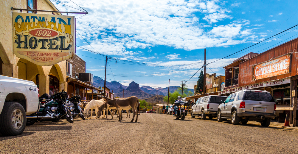 Motorcyclists cruise through a scenic Arizona ghost town